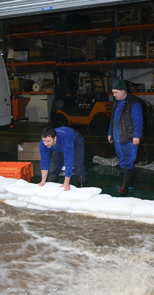 FloodSax alternative sandbags keeping torrential floodwater out of a warehouse