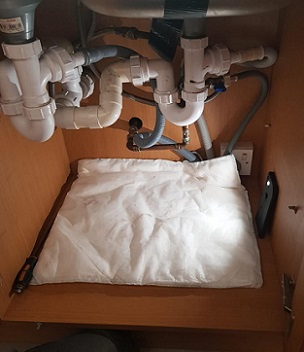 A FloodSax® in the bottom of a cupboard will absorb any leaks and drips from faulty pipework underneath the kitchen sink