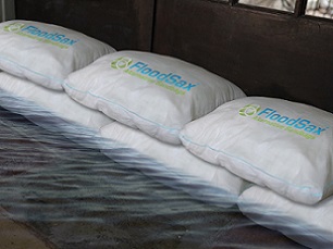An anti-flood barrier made from FloodSax sandless sandbags