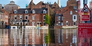 Flooding causes colossal damage within communities, forcing people out of their homes for months and closing businesses. Photo of flooded York taken by Andy Falconer.
