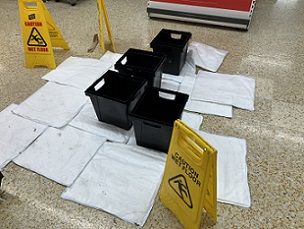 FloodSax sandless sandbags being used to soak up water from a leaking roof in a supermarket