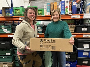 Welcome Centre warehouse manager Jess Johnstone (left) and volunteer Jo Pearce with another box of 20 FloodSax alternative sandbags