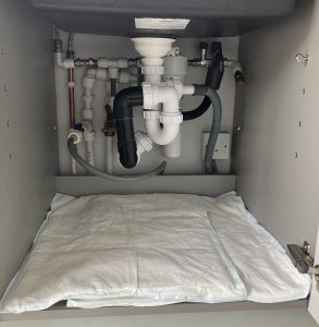 FloodSax soaking up water leaking from under the sink