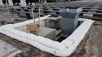 FloodSax alternative sandbags preventing water getting into a commercial building from a faulty air conditioning unit